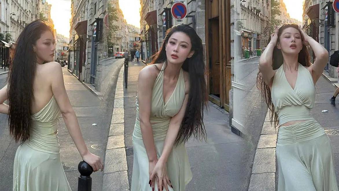 张馨予晒巴黎街拍，穿淡绿长裙清新靓丽身材好