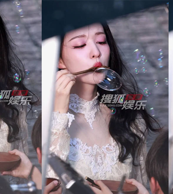 王楚然穿白裙吹泡泡，眉眼低垂温婉动人
