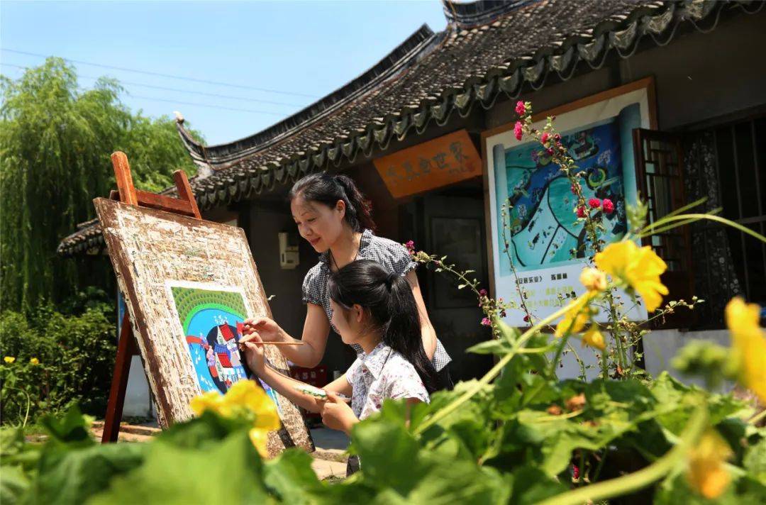 将春和景明映入画卷金山农民画里的江南春色究竟有多美