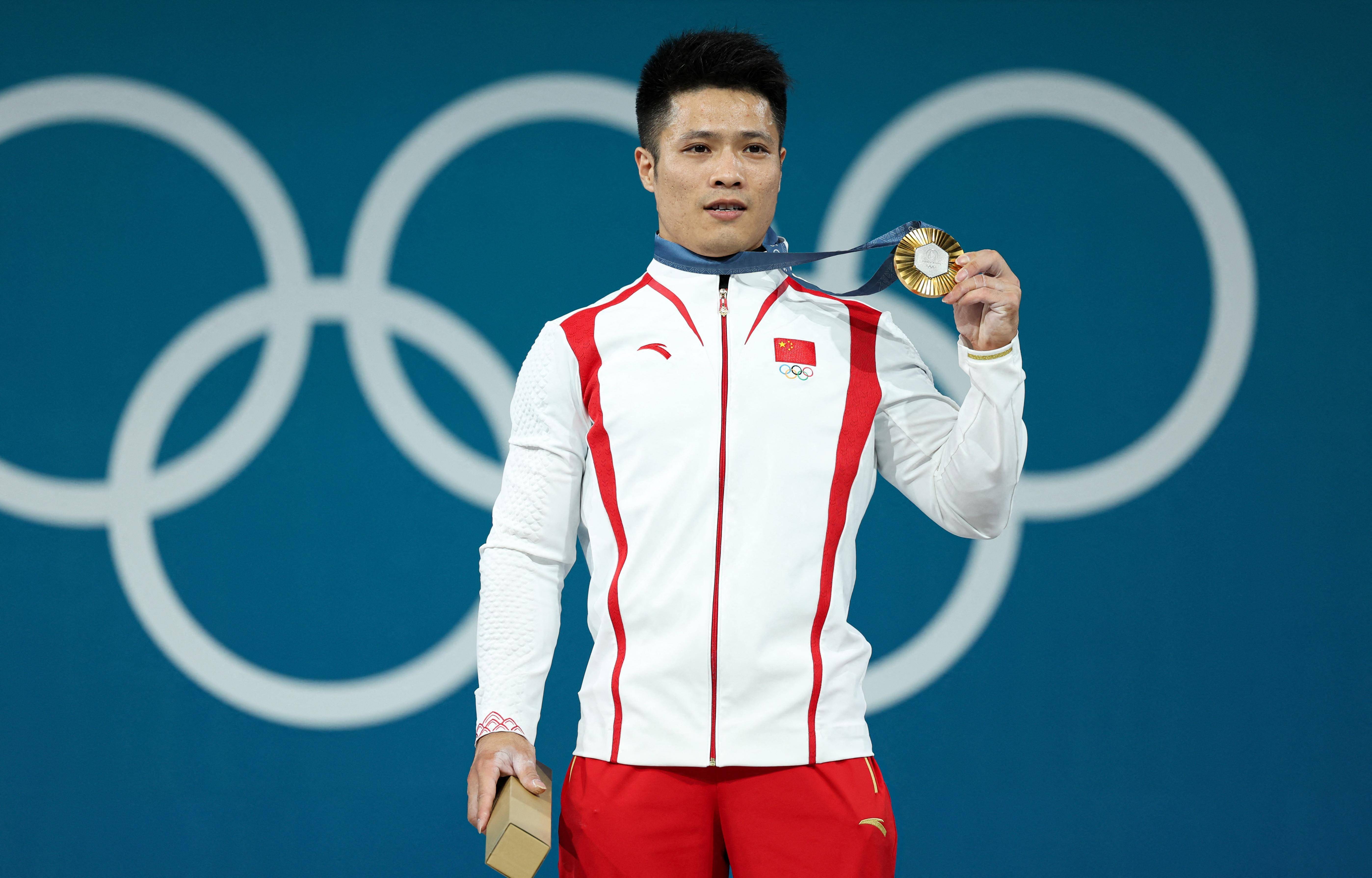 中国举重队迎开门红06李发彬连续两届奥运会登上最高领奖台