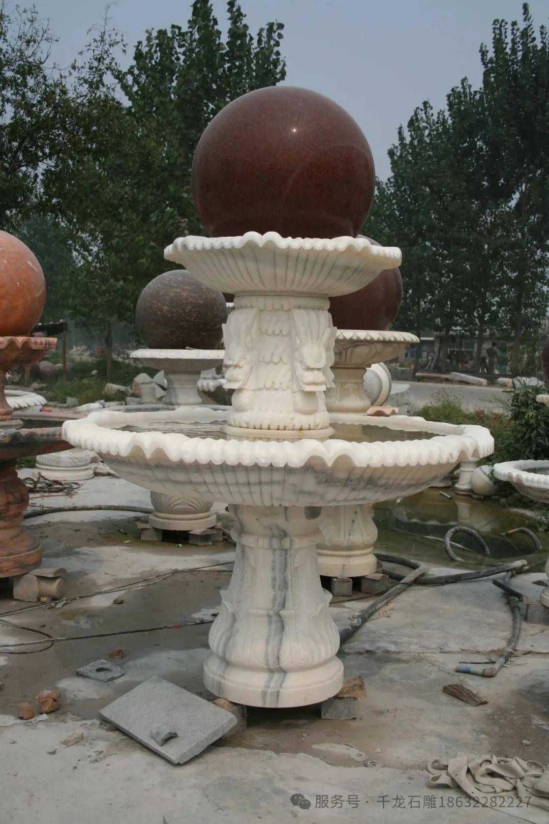 石雕喷泉风水球:现代小区景观的文化点睛之笔